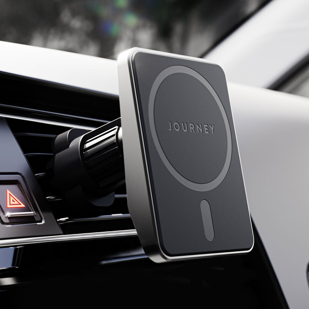 Car phone holder with 'Journey' branding on a car dashboard