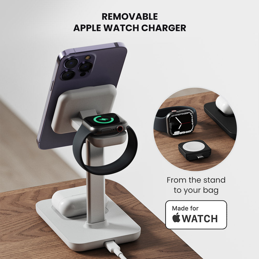 Removable Apple Watch charger with phone and watch on a stand, on a wooden surface.