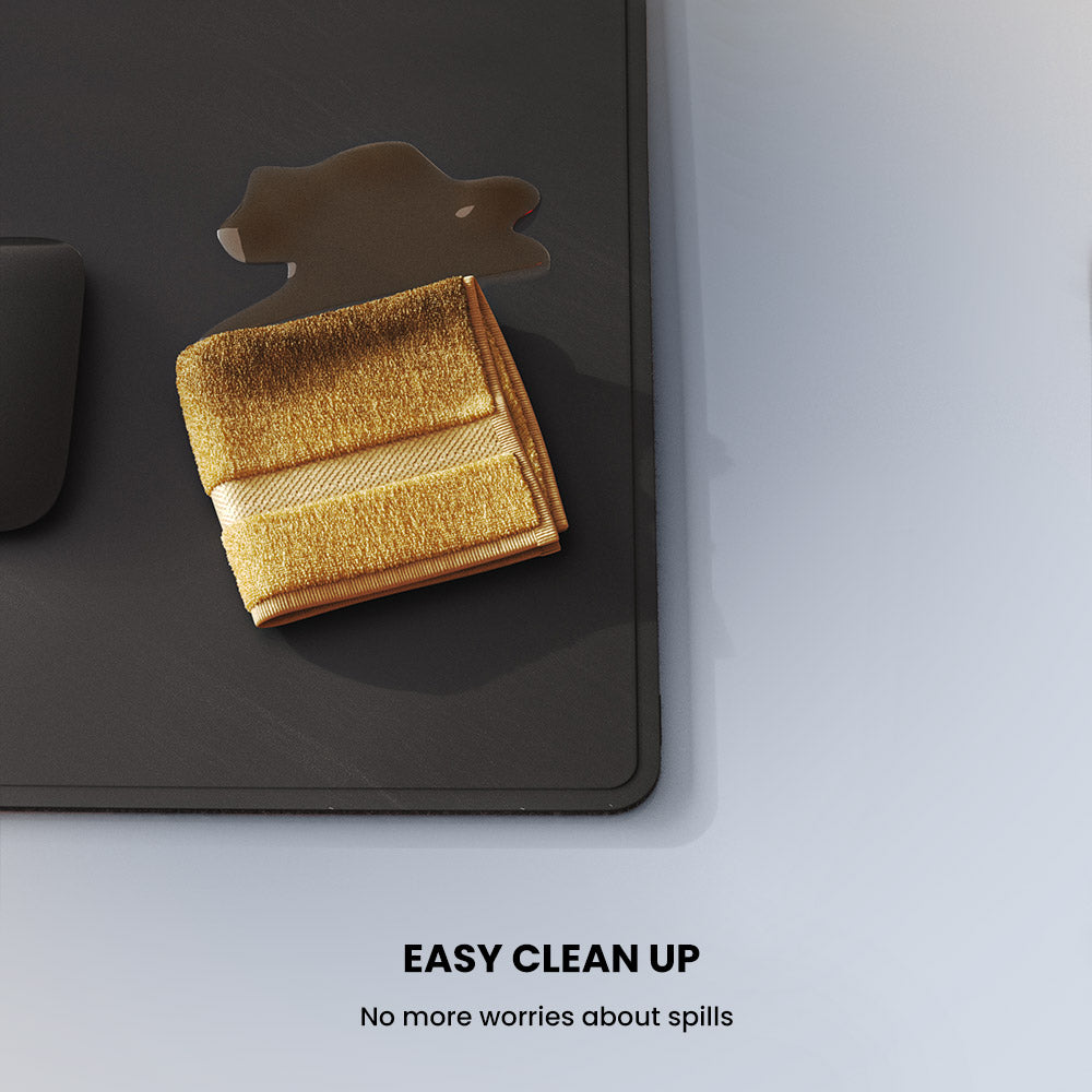 Gold cloth on a black surface with a spill, labeled 'Easy Clean Up' on a gray background.