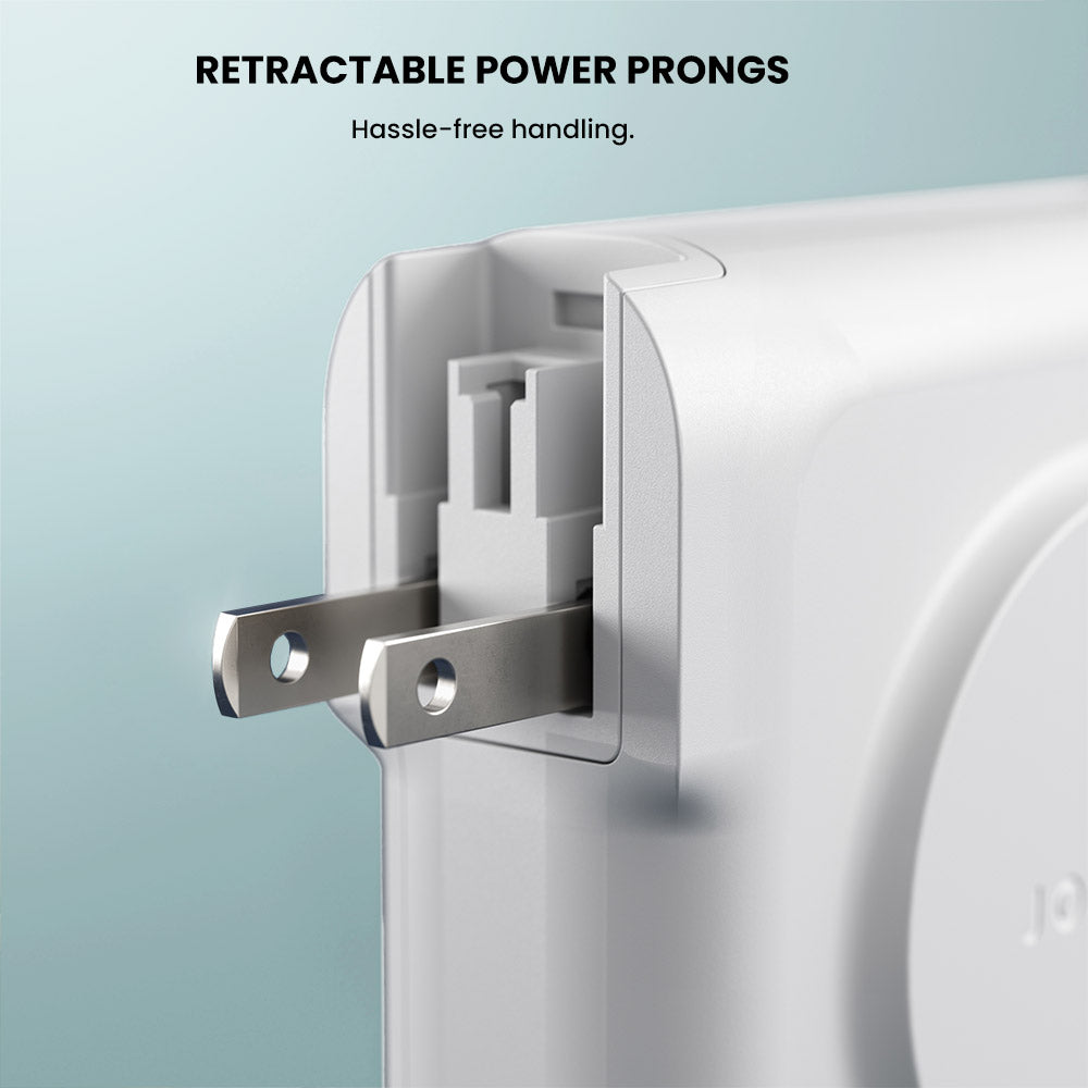 Retractable power prongs on a white appliance with a light blue background