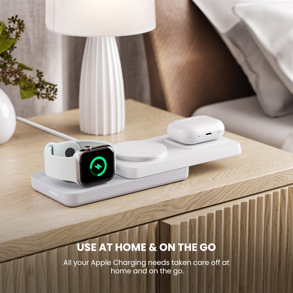 Wireless charging station on a wooden surface with Apple devices, text 'Use at home & on the go'.