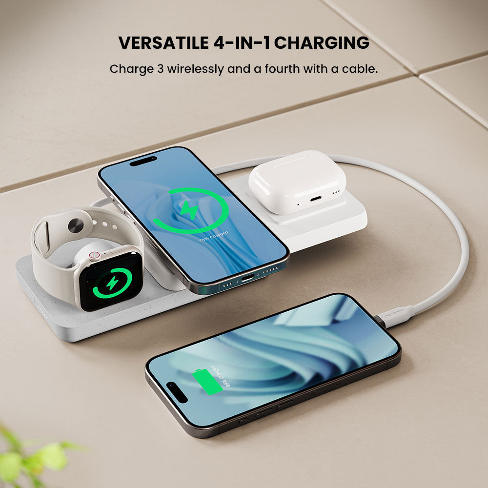 4-in-1 wireless charging station with smartphone, smartwatch, and earbuds on a light surface.