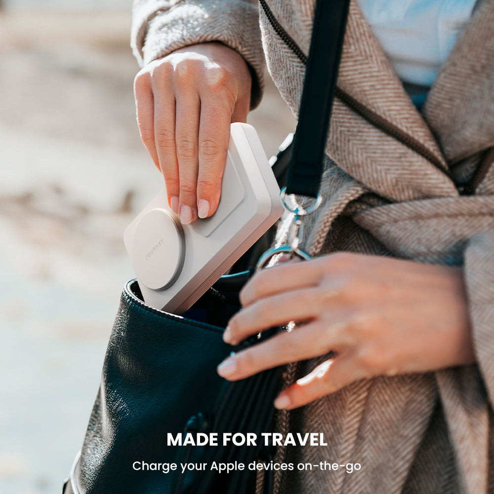 Person charging an Apple device with a portable charger, with text 'MADE FOR TRAVEL' and 'Charge your Apple devices on-the-go'.