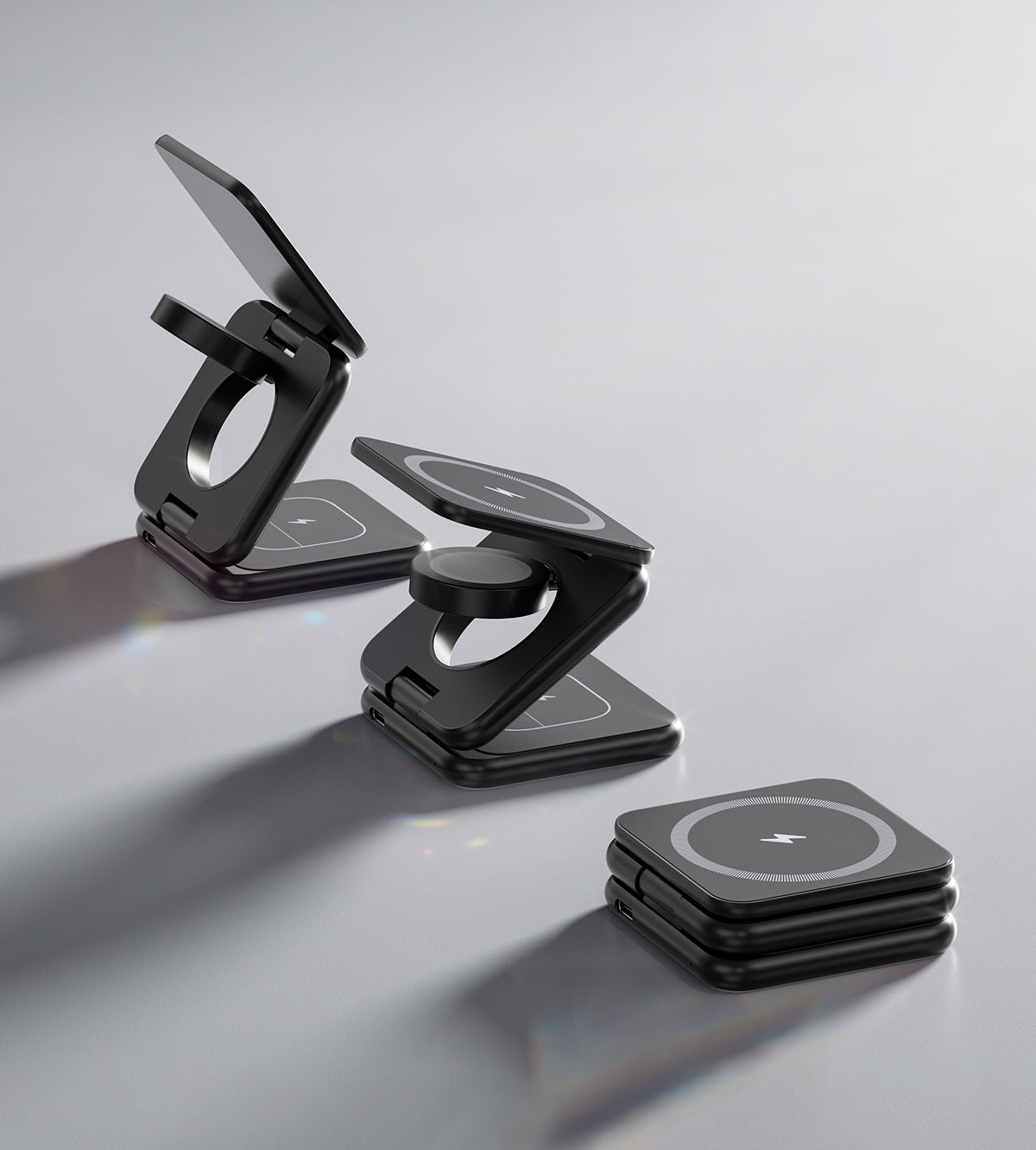 Black phone holder and stand on a light gray background