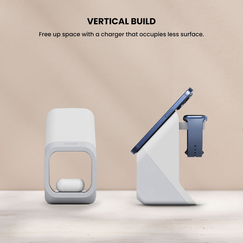 Vertical charging stand with smartphone, smartwatch, and wireless earbuds on a beige background.