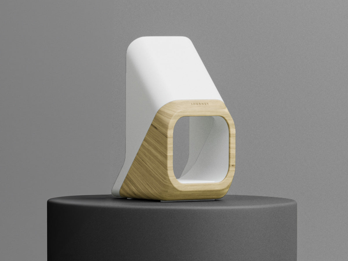 Modern lamp with white top and wooden base on a gray background