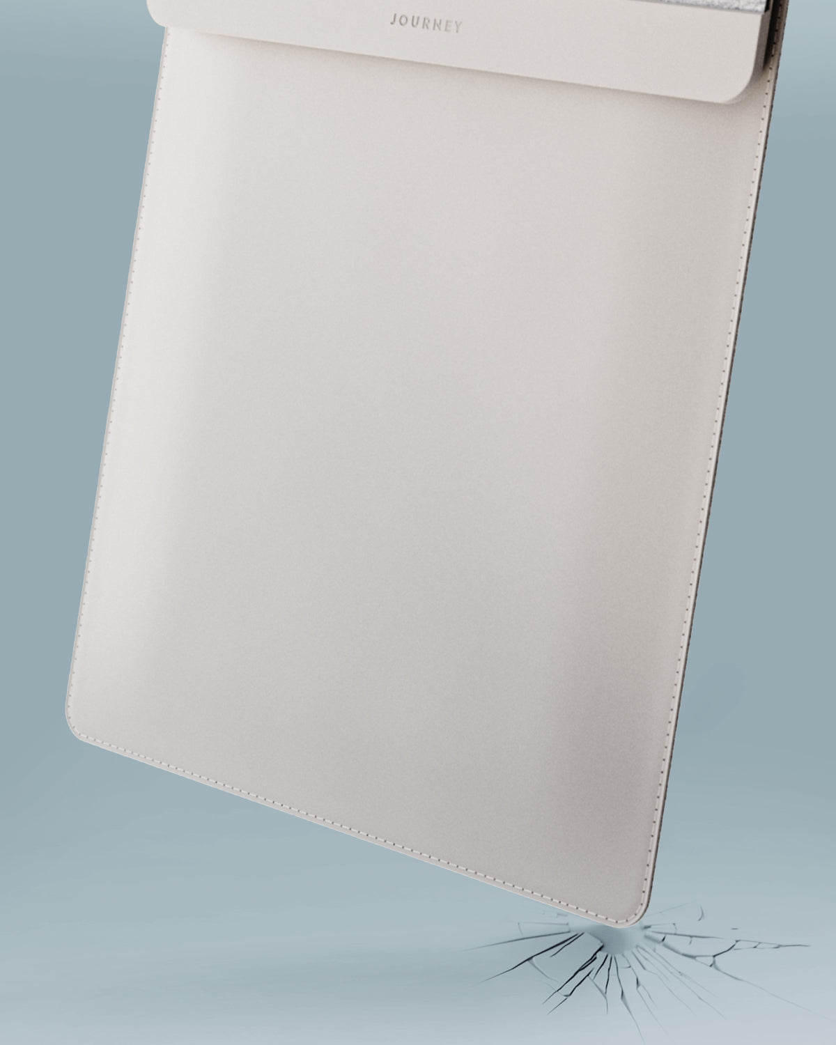 Beige pouch with 'Joules' branding on a light blue background