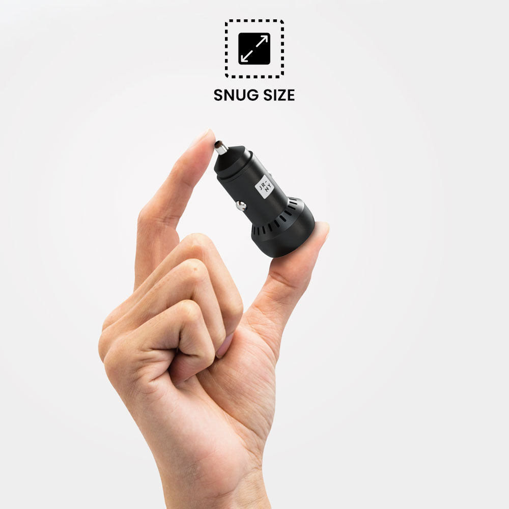 Black car charger held between fingers with 'Snug Size' label above on a white background