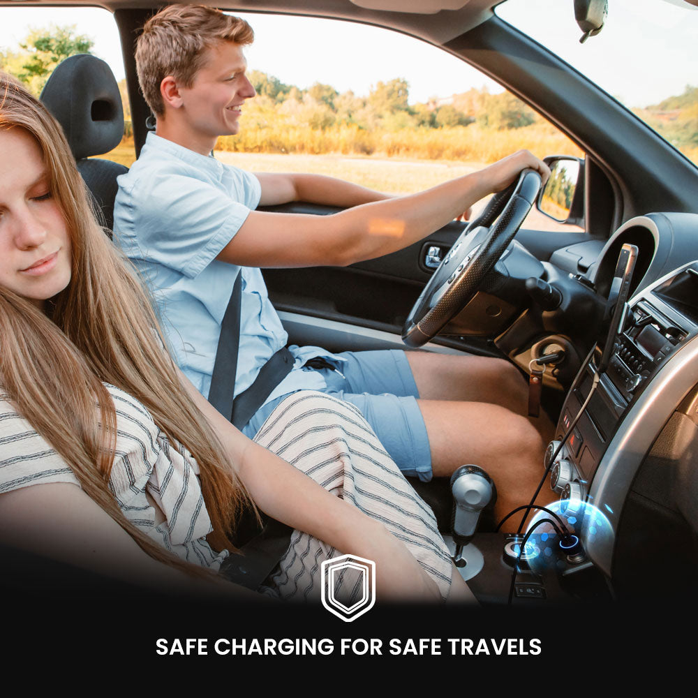 Two people in a car with a focus on safe charging for safe travels.