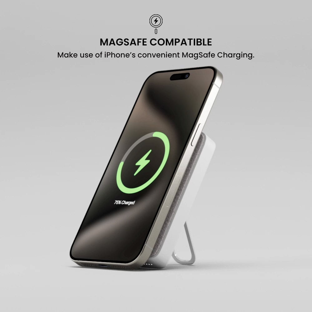 Smartphone with MagSafe charging feature on a gray background