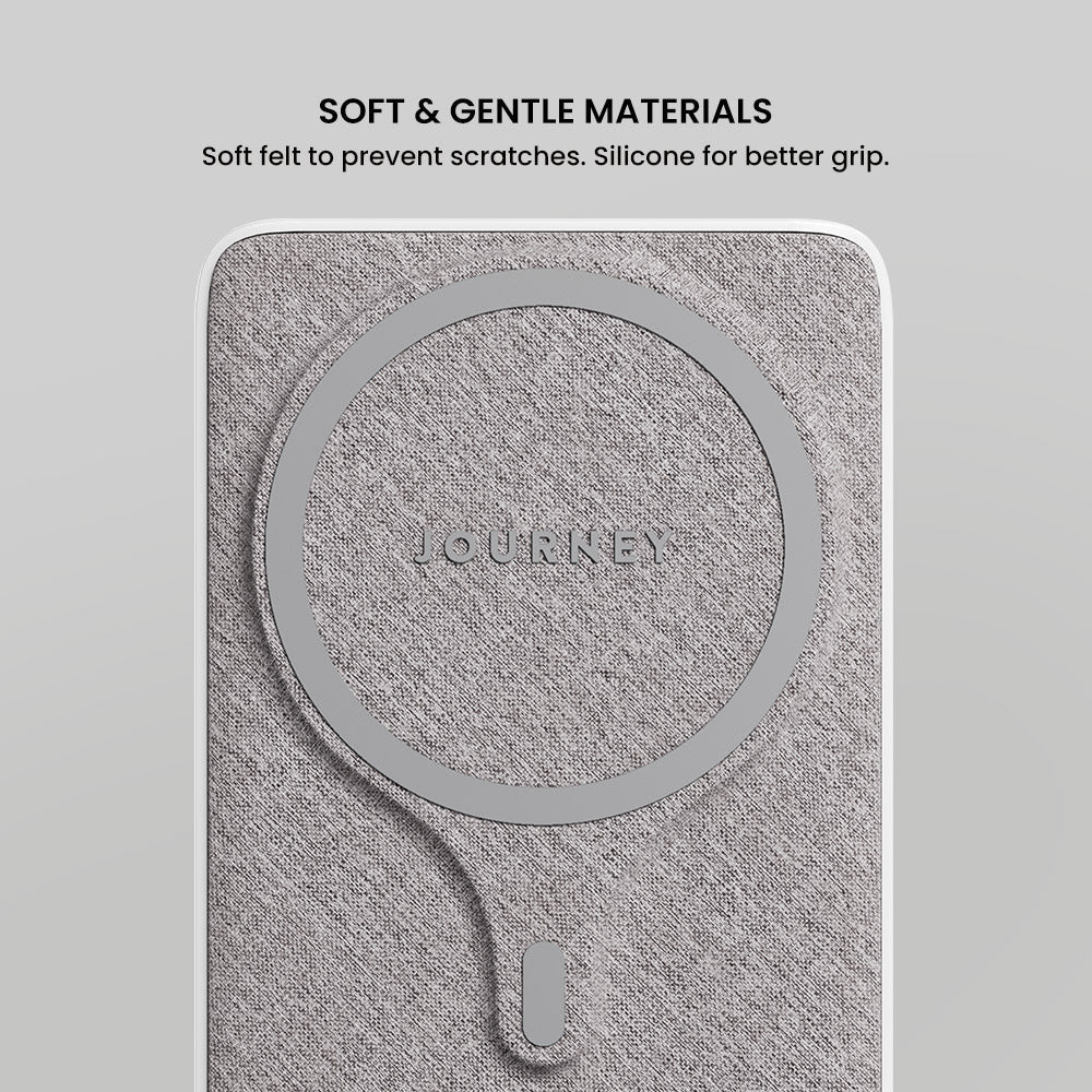 Gray phone case with 'Journey' branding on a light gray background