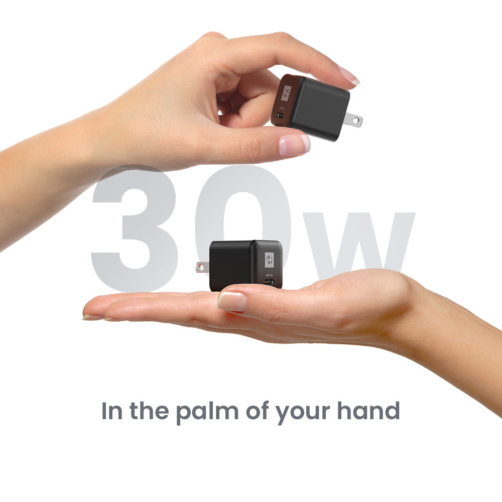 Two hands holding two small electronic devices with '30W' text in the background.