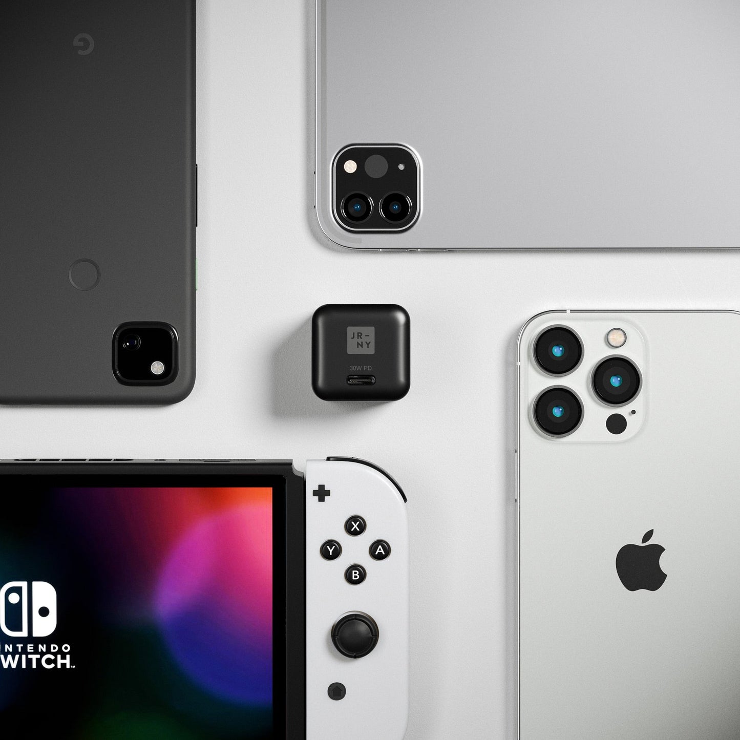 Collection of electronic devices including a phone, tablet, and gaming console on a white background.