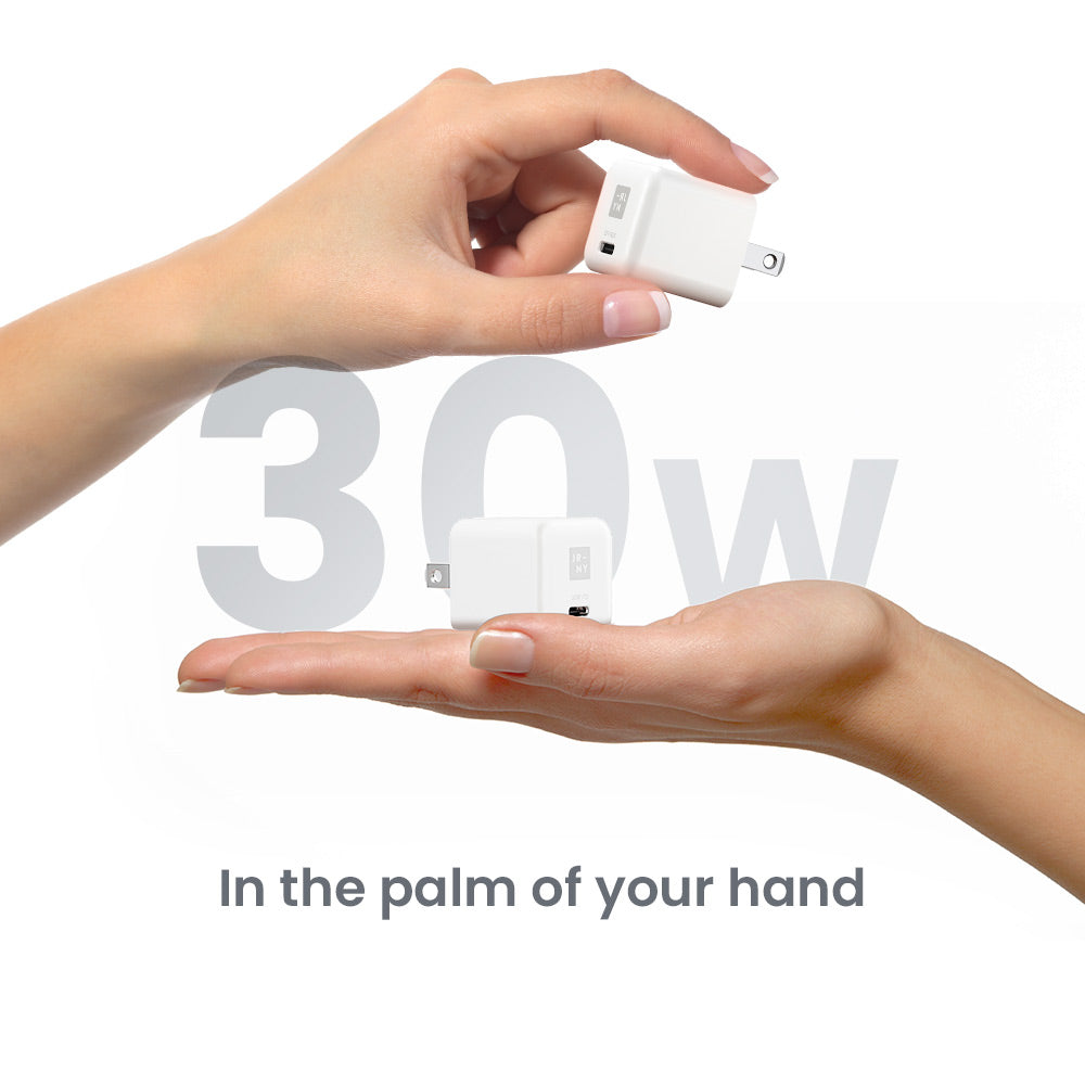 Two hands holding a small white device with '30W' text in the background.
