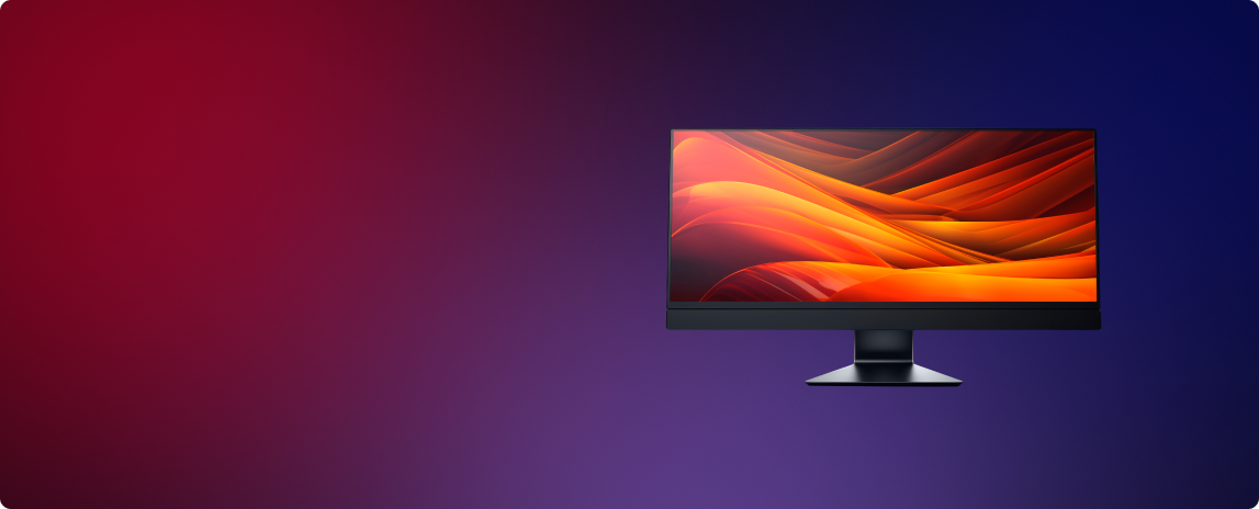 Monitor with colorful display on a gradient red to blue background